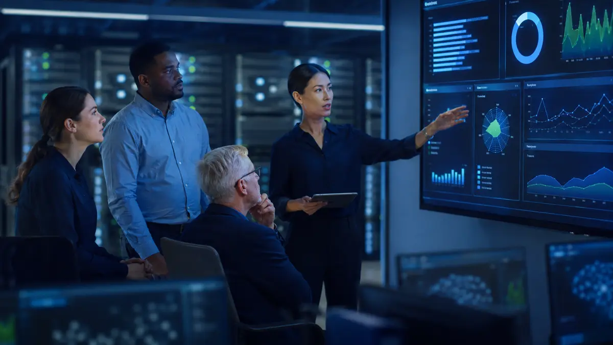 Information-security team reviewing risk and governance in a secure operations center